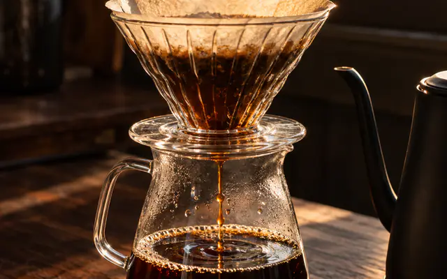 Coffee dripping through a glass pour-over